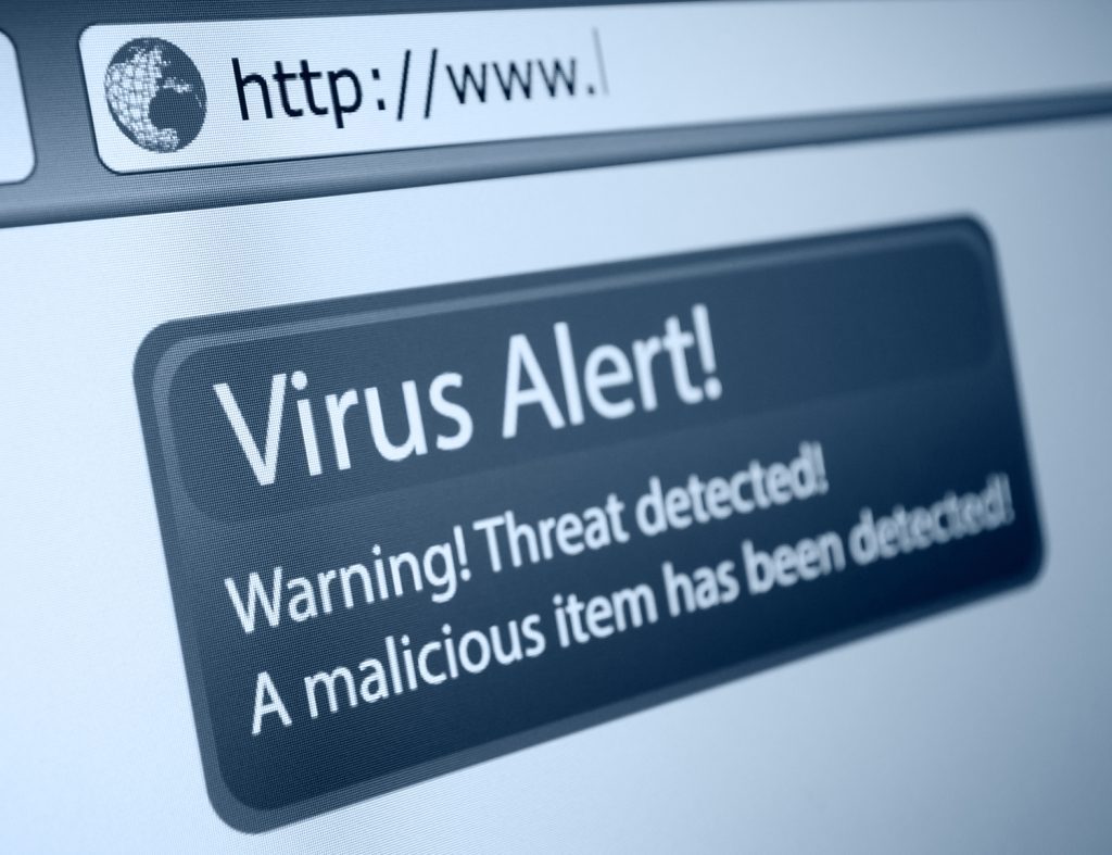 A web browser showing a virus alert pop-up.